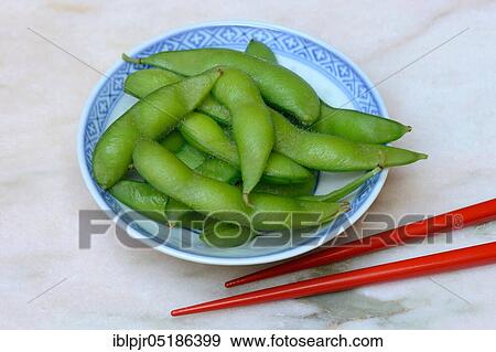 Stock Photo - Edamame, cooked unripe Soya beans (Glycine max) in a bowl. Fotosearch