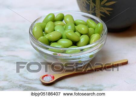 Edamame, cooked unripe Soya beans (Glycine max) in bowl, spoon with spiced salt Shichimi Togarashi View Large Photo Image Stock Photo - Edamame, cooked unripe Soya beans (Glycine max) in bowl, spoon with spiced salt Shichimi Togarashi. Fotosearch