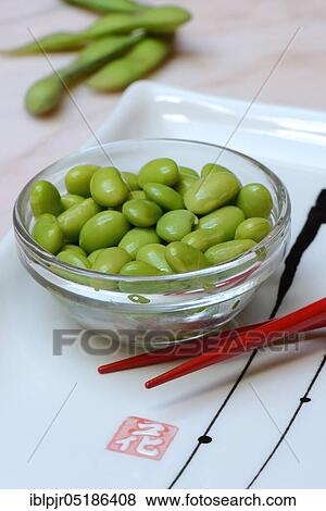 Stock Photo - Edamame, cooked unripe Soya beans (Glycine max) in a bowl. Fotosearch