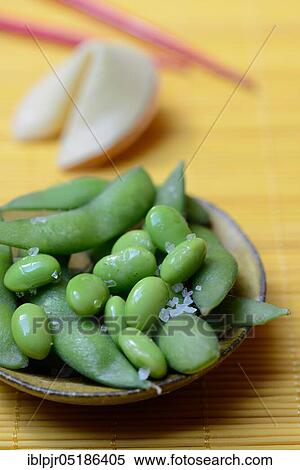 Edamame, cooked unripe Soya beans (Glycine max) in bowl, seasoned salt Shichimi Togarashi View Large Photo Image Stock Photography - Edamame, cooked unripe Soya beans (Glycine max) in bowl, seasoned salt Shichimi Togarashi. Fotosearch