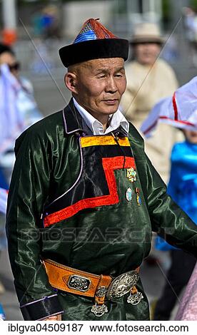 Elderly man in traditional Deel clothing, procession at the festival of the Mongolian national costume, Ulaanbaatar, Mongolia, Asia View Large Photo Image Stock Photo - Elderly man in traditional Deel clothing, procession at the festival of the Mongolian national costume, Ulaanbaatar, Mongolia, Asia. Fotosearch