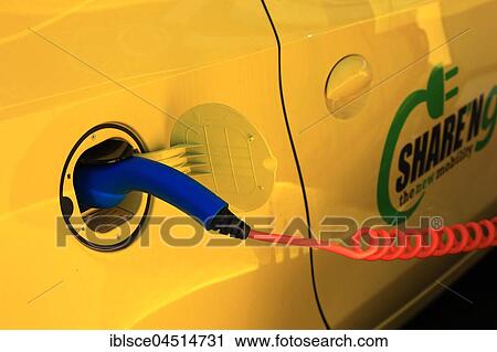Electric car at the charging station with charging cable, Electric car sharing service, Milan, Italy, Europe View Large Photo Image Stock Image - Electric car at the charging station with charging cable, Electric car sharing service, Milan, Italy, Europe. Fotosearch
