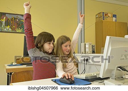 Elementary school girls working in computer room, Lower Saxony, Germany, Europe View Large Photo Image Stock Photograph - Elementary school girls working in computer room, Lower Saxony, Germany, Europe. Fotosearch