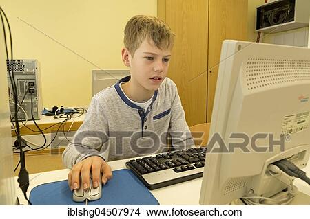 Elementary school student working in computer room, Lower Saxony, Germany, Europe View Large Photo Image Picture - Elementary school student working in computer room, Lower Saxony, Germany, Europe. Fotosearch