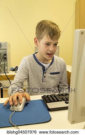 Elementary school student working in computer room, Lower Saxony, Germany, Europe View Large Photo Image Stock Photograph - Elementary school student working in computer room, Lower Saxony, Germany, Europe. Fotosearch
