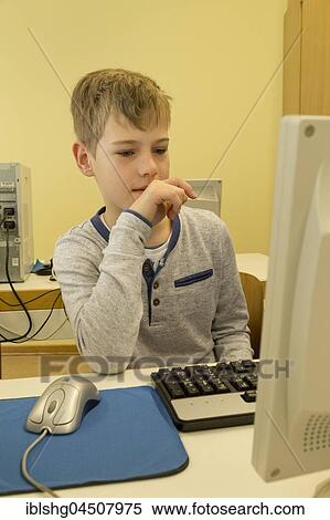 Elementary school student working in computer room, Lower Saxony, Germany, Europe View Large Photo Image Stock Photography - Elementary school student working in computer room, Lower Saxony, Germany, Europe. Fotosearch