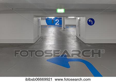 Empty underground car park and blue arrow on the floor, Biberach, Baden-Württemberg, Germany, Europe View Large Photo Image Stock Image - Empty underground car park and blue arrow on the floor, Biberach, Baden-Württemberg, Germany, Europe. Fotosearch