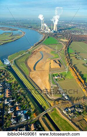 Emscher flowing into the Rhine, Rheinaue wetlands, power plant Voerde at back, Dinslaken, Ruhr district, North Rhine-Westphalia, Germany, Europe View Large Photo Image Stock Image - Emscher flowing into the Rhine, Rheinaue wetlands, power plant Voerde at back, Dinslaken, Ruhr district, North Rhine-Westphalia, Germany, Europe. Fotosearch