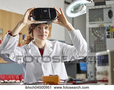 Engineer with white lab coat with VR goggles, Austria, Europe View Large Photo Image Stock Image - Engineer with white lab coat with VR goggles, Austria, Europe. Fotosearch