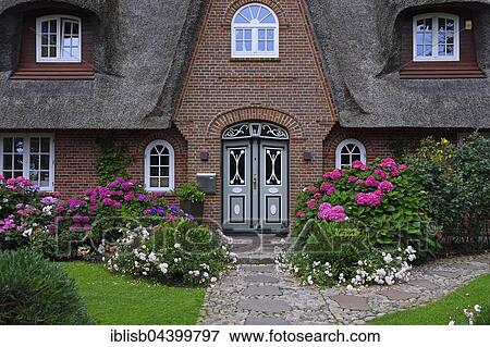 Stock Photo - Entrance, traditional old Frisian house, thatched house, Keitum, Sylt, North Frisian Islands, North Frisia, Schleswig-Holstein, Germany, Europe. Fotosearch