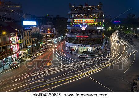 Stock Photo - Evening rush hour, cars and mopeds in the historic centre, the Hoan Kiem lake, Hang Trong, Hoan Kiem, Hanoi, Vietnam, Asia. Fotosearch