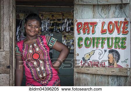 Stock Photography - Female hairdresser waiting for customers, coiffure, Campo, Southern Region, Cameroon, Africa. Fotosearch