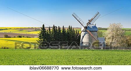 Stock Image - Field landscape with tower windmill in spring, Niedermöllern, Saxony-Anhalt, Germany, Europe. Fotosearch