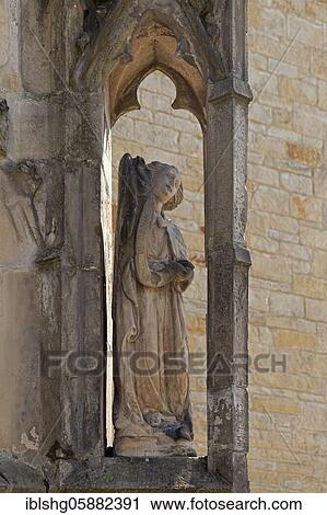 Stock Image - Figure on the outer wall, High Cathedral, Hildesheim, Lower Saxony, Germany, Europe. Fotosearch