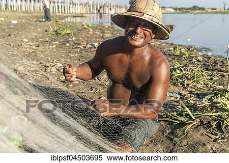 Fisherman mending his net Taungthaman Lake, Amarapura, Mandalay, Myanmar, Asia View Large Photo Image Stock Photography - Fisherman mending his net Taungthaman Lake, Amarapura, Mandalay, Myanmar, Asia. Fotosearch