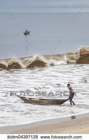 Fisherman with a dugout canoe on the beach, Kribi, South Region, Cameroon, Africa View Large Photo Image Stock Photo - Fisherman with a dugout canoe on the beach, Kribi, South Region, Cameroon, Africa. Fotosearch