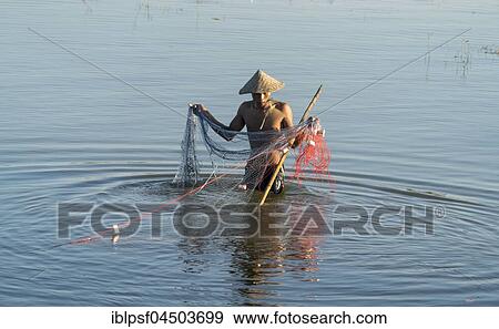 Stock Photo - Fishermen with net in Taungthaman Lake, Amarapura, Mandalay, Myanmar, Asia. Fotosearch