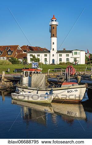 Fishing boats and lighthouse in the harbour of Timmendorf on the island of Poel, Mecklenburg-Vorpommern, Germany, Europe View Large Photo Image Stock Photography - Fishing boats and lighthouse in the harbour of Timmendorf on the island of Poel, Mecklenburg-Vorpommern, Germany, Europe. Fotosearch