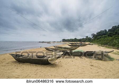 Fishing boats on the beach of Kribi, Cameroon, Africa View Large Photo Image Stock Photograph - Fishing boats on the beach of Kribi, Cameroon, Africa. Fotosearch