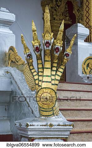 Five-headed mythological Naga serpent decorates the end of a stair railing, Wat Nong Sikhounmuang temple, Luang Prabang, Laos, Asia View Large Photo Image Stock Photo - Five-headed mythological Naga serpent decorates the end of a stair railing, Wat Nong Sikhounmuang temple, Luang Prabang, Laos, Asia. Fotosearch