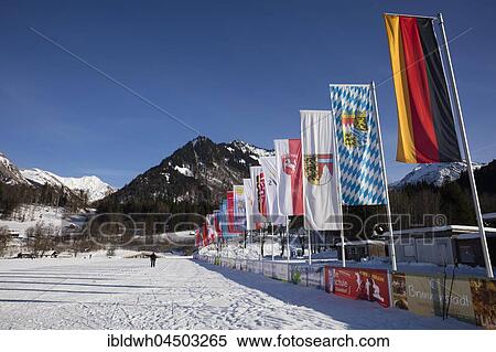 Flags with Germany flag, Nordic-Aktiv-Zentrum, Oberstdorf, Allgäu Alps, Allgäu, Bavaria, Germany, Europe View Large Photo Image Stock Photography - Flags with Germany flag, Nordic-Aktiv-Zentrum, Oberstdorf, Allgäu Alps, Allgäu, Bavaria, Germany, Europe. Fotosearch