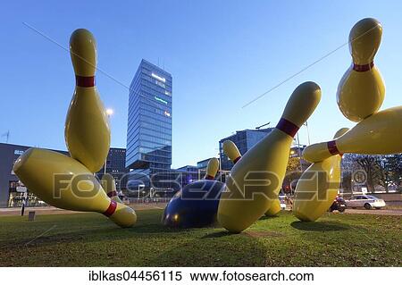 Flying Pins sculpture, pins are knocked down by bowling ball, artists Claes Oldenburg and Coosje van Bruggen, Pop Art, Eindhoven, Noord-Brabant, The Netherlands, Europe View Large Photo Image Stock Photography - Flying Pins sculpture, pins are knocked down by bowling ball, artists Claes Oldenburg and Coosje van Bruggen, Pop Art, Eindhoven, Noord-Brabant, The Netherlands, Europe. Fotosearch