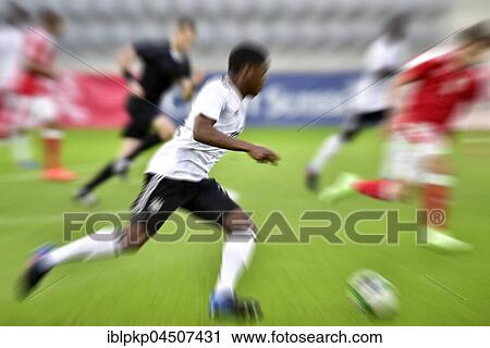 Football game, football player in motion, Biel, Switzerland, Europe View Large Photo Image Stock Image - Football game, football player in motion, Biel, Switzerland, Europe. Fotosearch