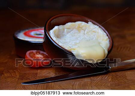 Stock Image - French soft cheese in clay pot, Saint-Marcellin, France, Europe. Fotosearch
