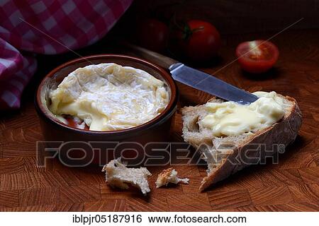 Stock Photograph - French soft cheese in clay pot, Saint-Marcellin, France, Europe. Fotosearch