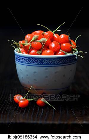 Picture - Fresh goji berries (Lycium barbarum) in a bowl. Fotosearch