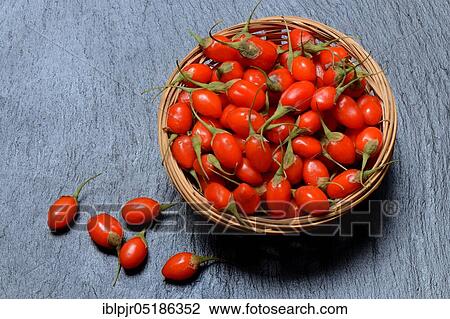 Stock Image - Fresh goji berries (Lycium barbarum) in cups. Fotosearch