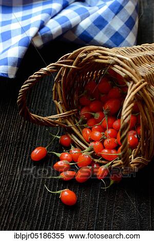 Stock Photography - Fresh goji berries (Lycium barbarum) in cups. Fotosearch
