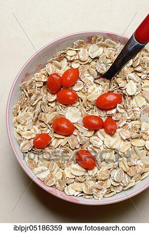 Fresh goji berries (Lycium barbarum) with cereal flakes in bowl with spoon View Large Photo Image Stock Photo - Fresh goji berries (Lycium barbarum) with cereal flakes in bowl with spoon. Fotosearch