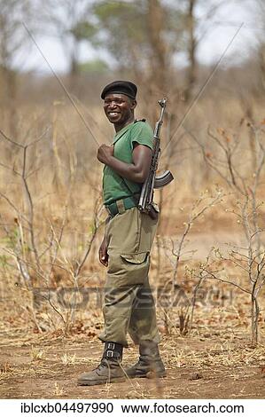 Gamekeeper with gun, Mosi-oa-Tunya National Park, Livingstone, Zambia, Africa View Large Photo Image Stock Image - Gamekeeper with gun, Mosi-oa-Tunya National Park, Livingstone, Zambia, Africa. Fotosearch