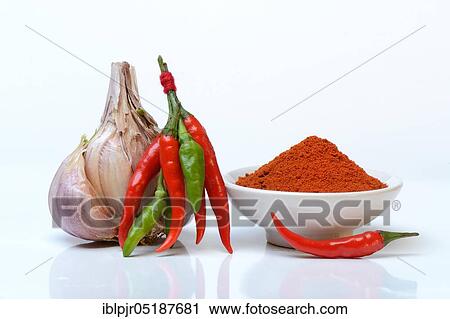 Stock Image - Garlicchilli powder, chilli peppers ( Capsicum frutescens) ( Allium sativum, ), chillies, chillies, chillies, chilli pepper, chilli, cayenne, cayenne pepper, piri-piri, tabasco, peperoncini. Fotosearch