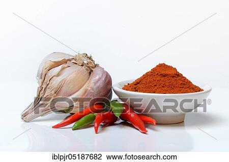 Stock Image - Garlicchilli powder, chilli peppers ( Capsicum frutescens) ( Allium sativum, ), chillies, chillies, chillies, chilli pepper, chilli, cayenne, cayenne pepper, piri-piri, tabasco, peperoncini. Fotosearch
