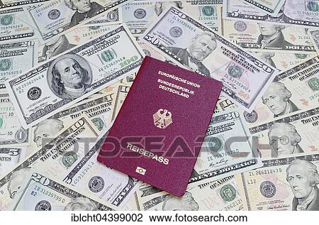 Stock Image - German passport and US dollar bills. Fotosearch