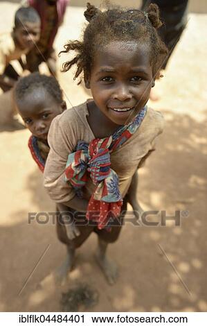 Girl carrying sister on her back, Analakely village, Tanambao commune, Madagascar, Africa View Large Photo Image Stock Image - Girl carrying sister on her back, Analakely village, Tanambao commune, Madagascar, Africa. Fotosearch