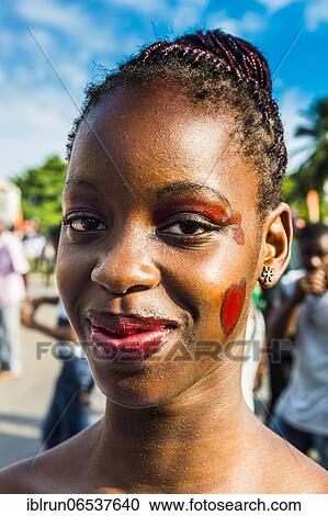 Stock Image - Girl posing at the Carneval in the town of Sao Tome, Sao Tome and Principe, Atlantic ocean, Africa. Fotosearch