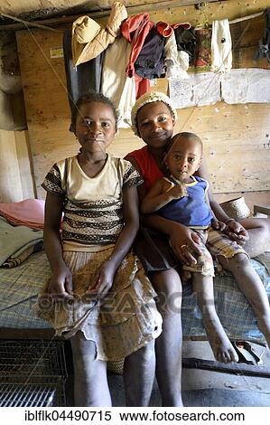 Girls, adolescents and young child in a simple hut, Ambatomainty village, Moramanga, Alaotra-Mangoro region, Madagascar, Africa View Large Photo Image Stock Photography - Girls, adolescents and young child in a simple hut, Ambatomainty village, Moramanga, Alaotra-Mangoro region, Madagascar, Africa. Fotosearch