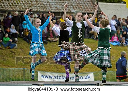 Stock Image - Girls dancing in kilts at the Ceres Highland Games folk dance competition, Ceres, Scotland, United Kingdom, Europe. Fotosearch
