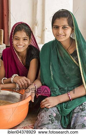 Girls doing housework, Bera, Rajasthan, India, Asia View Large Photo Image Stock Photo - Girls doing housework, Bera, Rajasthan, India, Asia. Fotosearch