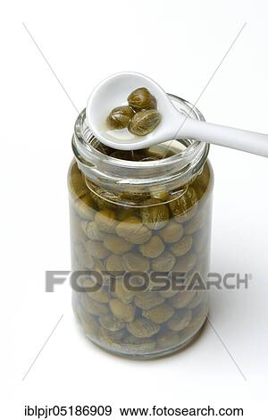 Glass and porcelain spoon with capers, inlaid ( Capparis spinosa) View Large Photo Image Stock Photo - Glass and porcelain spoon with capers, inlaid ( Capparis spinosa). Fotosearch