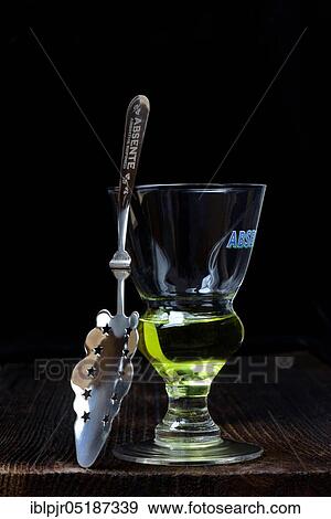 Glass of absinthe with absinthe spoon, Green Fairy View Large Photo Image Stock Photo - Glass of absinthe with absinthe spoon, Green Fairy. Fotosearch