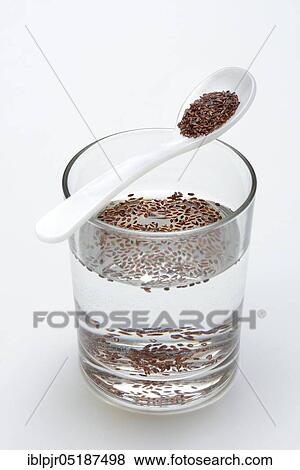 Glass of water and spoon with psyllium, sand plantain, Plantago psyllium View Large Photo Image Stock Photo - Glass of water and spoon with psyllium, sand plantain, Plantago psyllium. Fotosearch