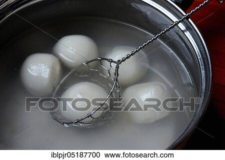 Glutinous rice balls in pot with hot water View Large Photo Image Stock Image - Glutinous rice balls in pot with hot water. Fotosearch