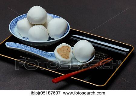 Glutinous rice balls with peanut filling in bowl and spoon View Large Photo Image Stock Photo - Glutinous rice balls with peanut filling in bowl and spoon. Fotosearch