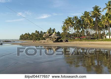 Golden pagodas on rocks at palm beach, Ngwe Saung, Myanmar, Asia View Large Photo Image Stock Photo - Golden pagodas on rocks at palm beach, Ngwe Saung, Myanmar, Asia. Fotosearch