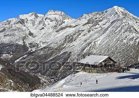 Gourmet Restaurant Spielboden in front of snowy peaks Fletschhorn, Lagginhorn and Weissmies, in the valley of Saas-Fee, Canton of Valais, Switzerland, Europe View Large Photo Image Picture - Gourmet Restaurant Spielboden in front of snowy peaks Fletschhorn, Lagginhorn and Weissmies, in the valley of Saas-Fee, Canton of Valais, Switzerland, Europe. Fotosearch