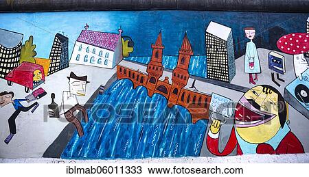 Stock Image - Graffiti Doin It Cool For The Eastside, with Spree and Oberbaum Bridge, artist Jim Avignon, mural at the East Side Gallery, Friedrichshain, Berlin, Germany, Europe. Fotosearch